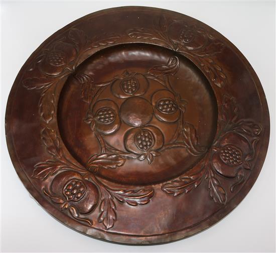 An Arts & Crafts embossed copper charger, probably Newlyn, 20in.(-)